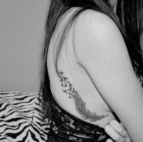 birds and feather tattoo on side