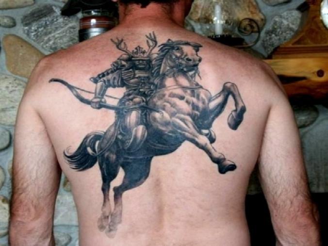 Warrior On Horse Grey Ink Tattoo On Back