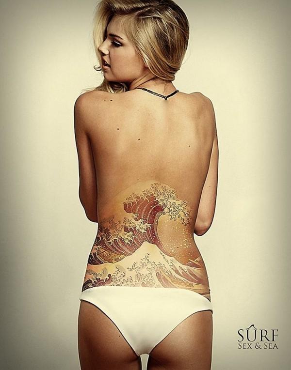wave tattoo at low back for girls 