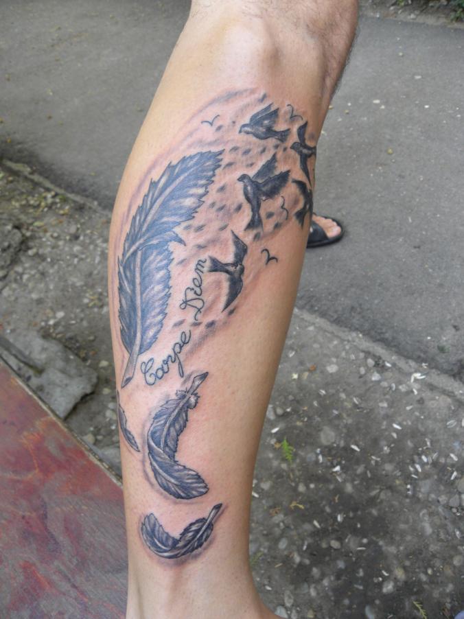 feather tattoo by Kiddotattoo