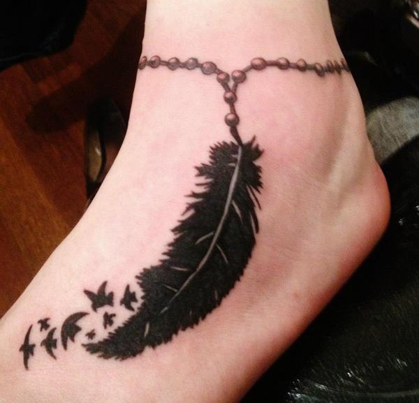  feather tattoo on foot