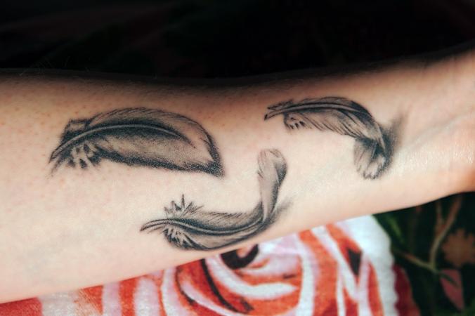 Grey Ink Feathers Tattoos on Left Arm