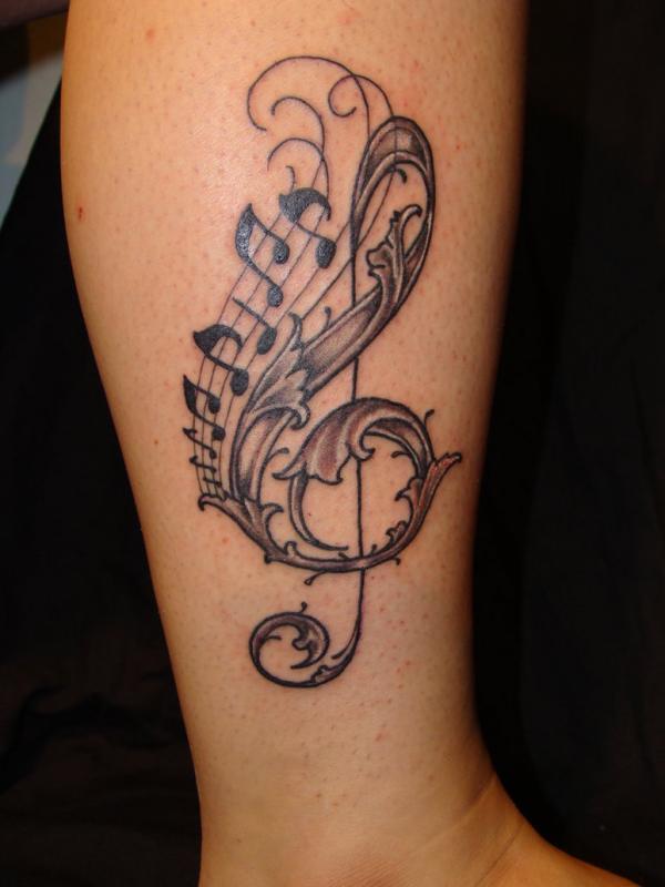 music note leg tattoo