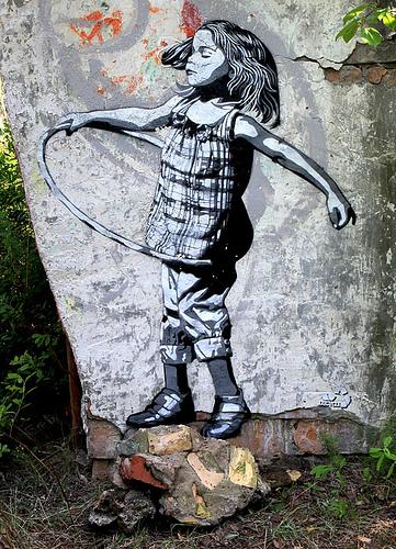 Street art - urban ethnology. Hula hoop princess