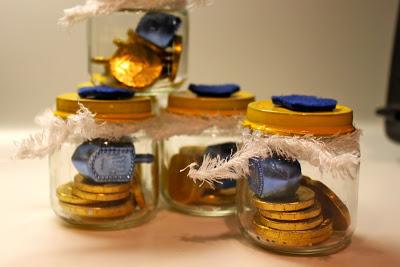 Fill a decorated baby food jar with Gelt and a dreidel to give as a Hanukkah gift. 