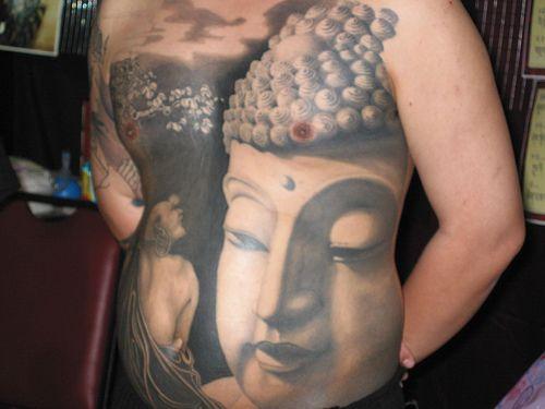 Asian Buddha Tattoo On Front Of The Body