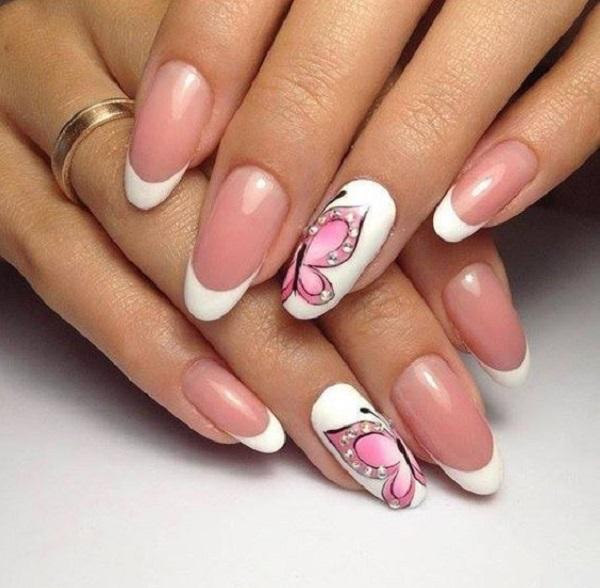 Wonderful looking butterfly nail art design in and French tips. The white French tips make the design look elegant and the pink butterfly on...