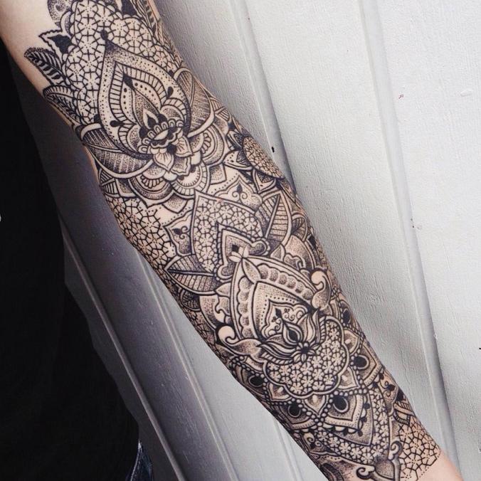 sprawling ornamenta tattoon on the inside of the arm