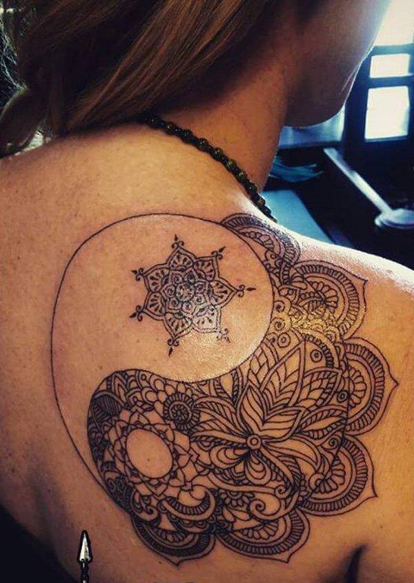 Another pretty looking Yin Yang tattoo. This tattoo is created with such intricate detail of flowers and tribal themes making it truly stand...