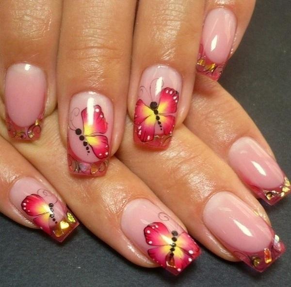 A refreshing butterfly nail art design with French tip. The bright red and yellow colors lighten up the design as the butterfly looks as if ...