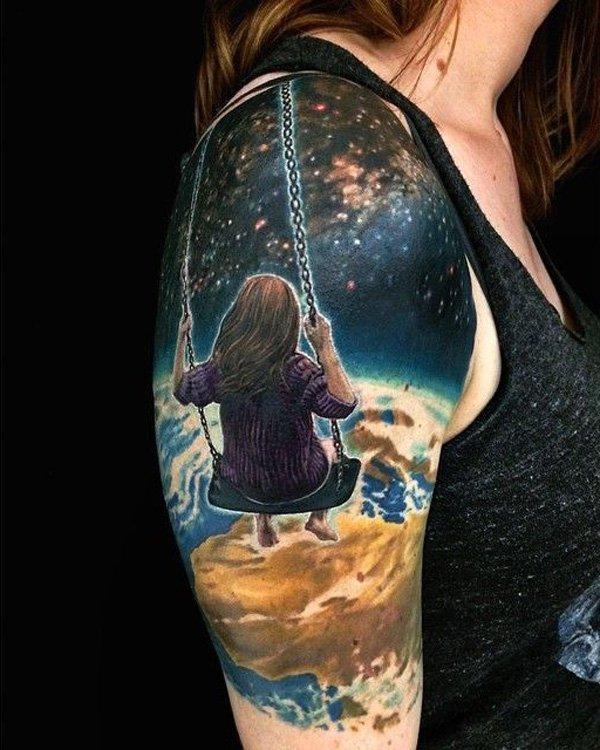 This tattoo shows a girl in a swing looking down at earth from the universe. Surreal but beautiful. Plus the story behind it could depend on...