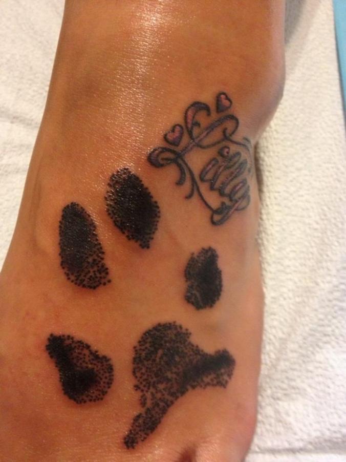 dog paw tattoo on foot