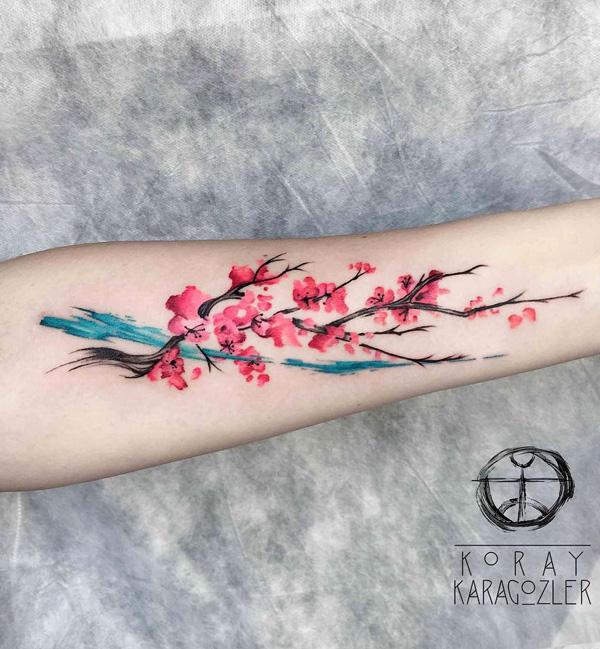 Beautiful cherry blossom tattoo on the arm. The arm is one of the best places to put a cherry blossom tattoo since it can give way to the de...
