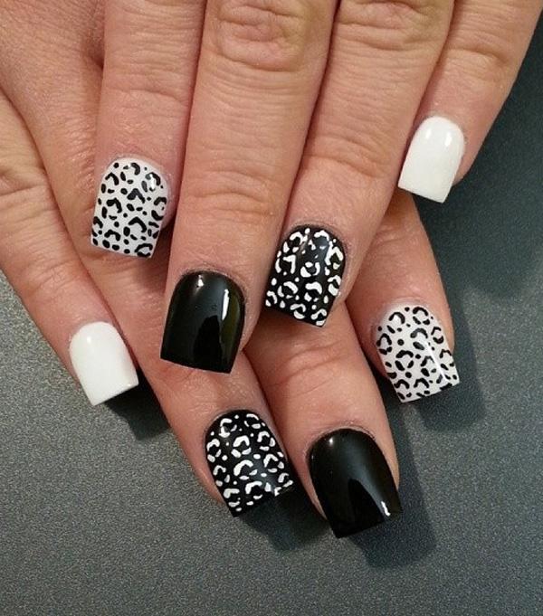 Black and white leopard nail art design. The alternating effect of the prints and backgrounds give this effect a sleek appearance. It’s gorg...