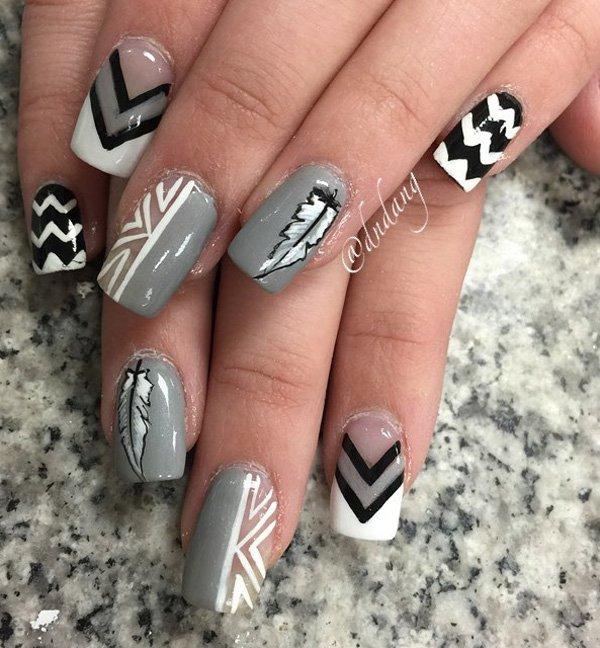 Perfect winter nail art design. Use winter hues such as black, gray and white to create tribal images and designs on your nails.
