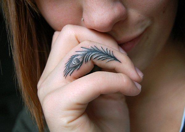 9 Peacock finger tattoo