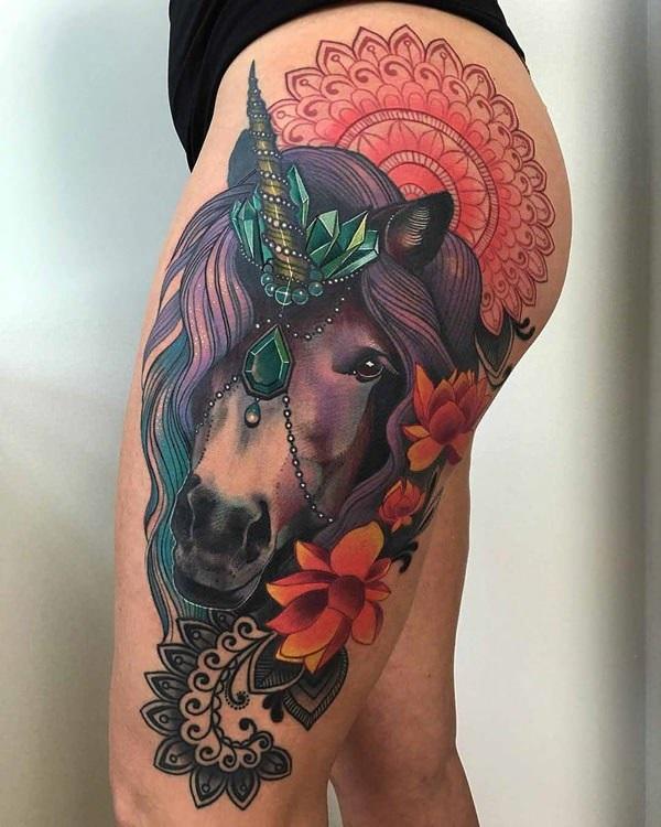 Very detailed unicorn tattoo on the thighs. The striking colors that the design has is absolutely well details and beautiful. You can see th...