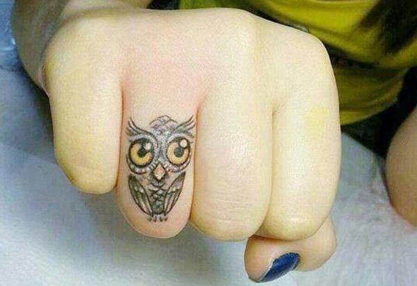 33 owl finger tattoo