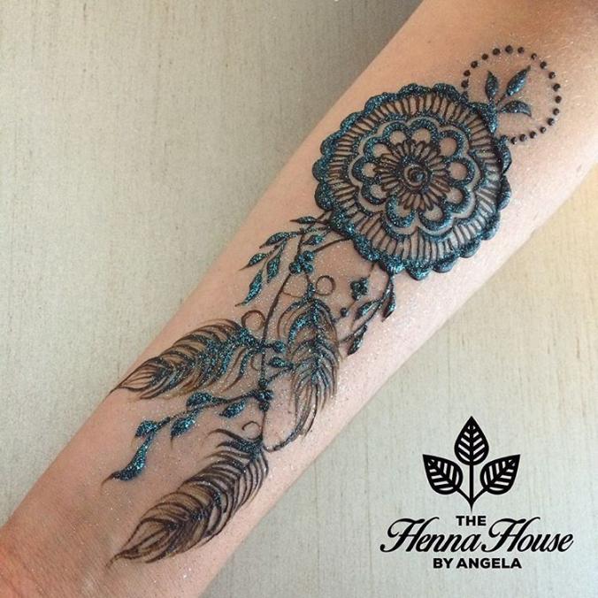 henna tattoo dreamcatcher on hands