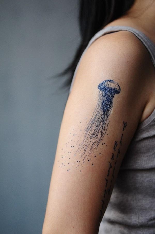 Amazing jellyfish tattoo on the arm. The design is very small yet has a great impact because of how the space on the arm is utilized. You ca...