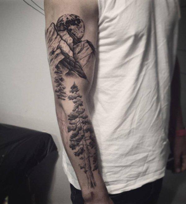 This sleeve tattoo shows a mountain range as well as a tree. Both of these could symbolize strength and endurance. And it’s simply a beautif...