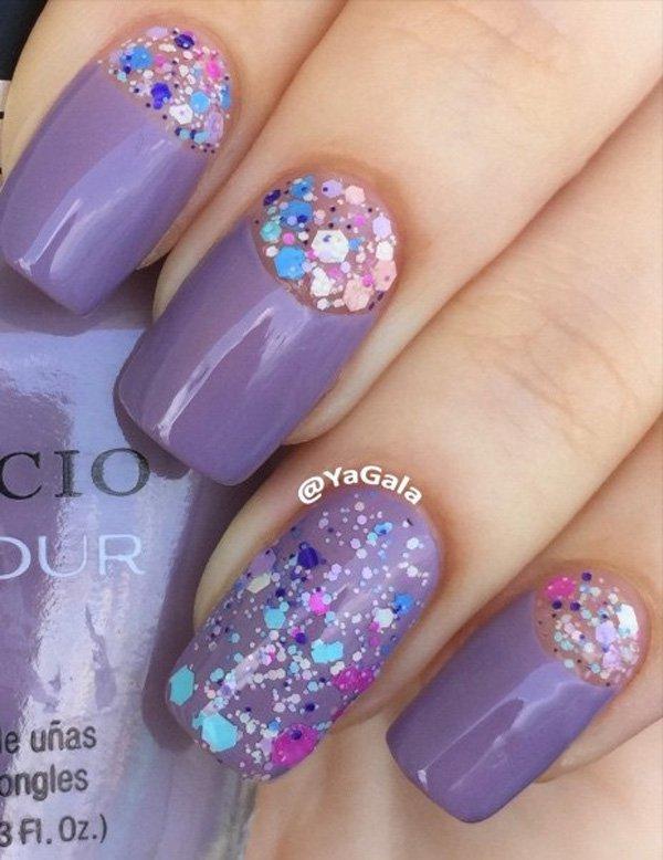 If you want a bit of a girly design, this purple nail polish with rhinestones is perfect for you. Instead of leaving the half moon transpare...