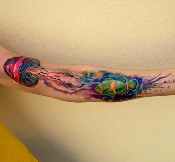 Stunning jellyfish tattoo on the arm. The very colorful dn beautiful form of the jellyfish is clearly seen on this design. It makes good use...