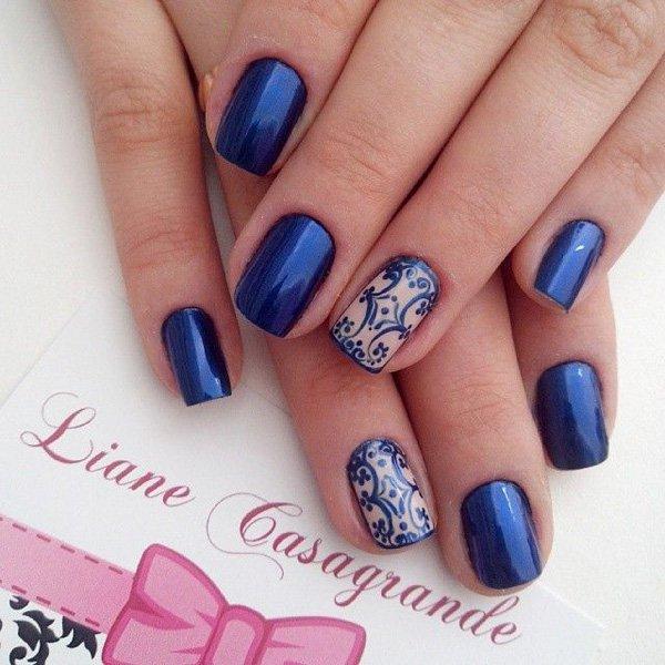 Simple and creative looking dark blue nail art design. The simple nail art designs makes it look neat and clean. The opposite designs of ful...