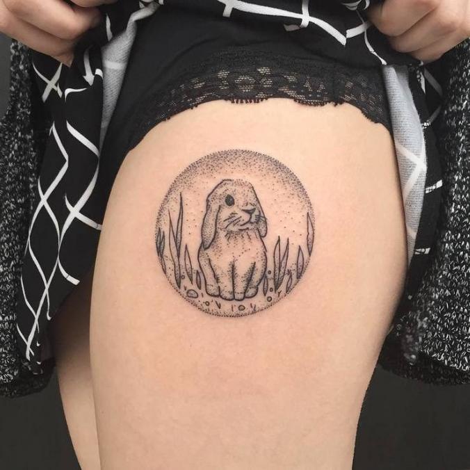 Simple bunny tattoo on leg