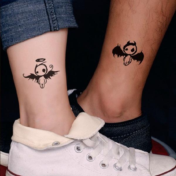 Very similar to an above tattoo these little angels are both cute but deceptively so. You have the devil on one side and the angel on the ot...
