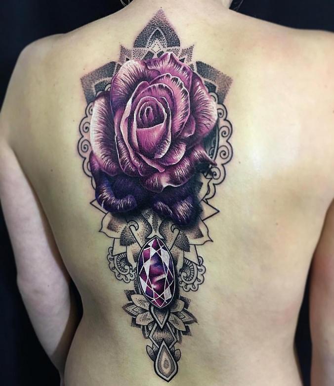 Flower and mandala themed back tattoo