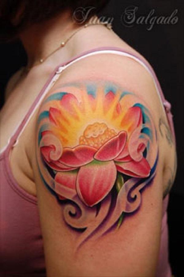 Pink lotus flower tattoo in blossom. The center part of the lotus flower is shown to be shining with bright light thus emphasizing on the le...