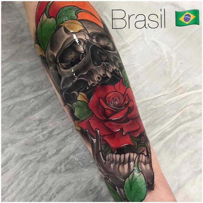 Skull and rose sleeve tattoo