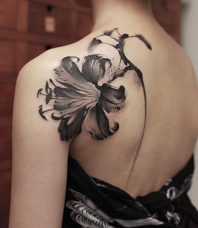 Lily back tattoo