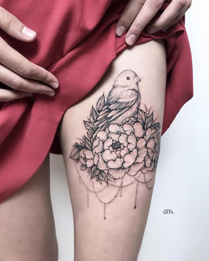 Flower and bird thigh tattoo