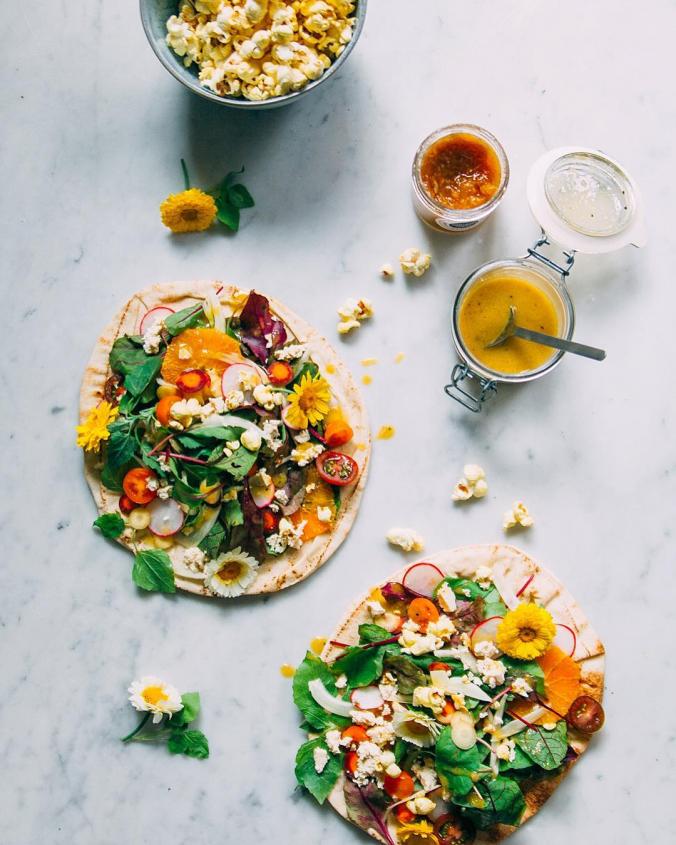 Recipes with flavor explosions like grilled flatbreads with wild herb salad and mango horseradish vinaigrette. 