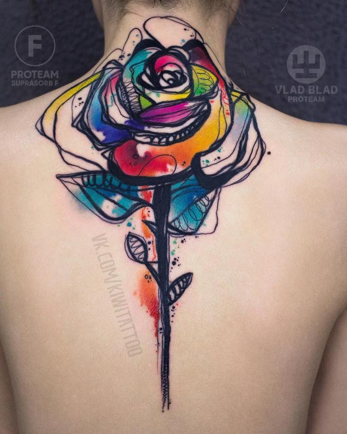 Colorful watercolor rose back tattoo
