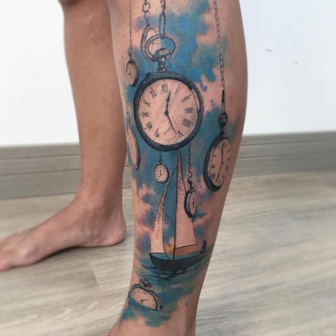 Watercolor watch leg tattoo