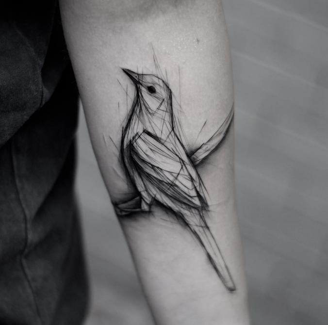 Bird tattoo on sleeve 