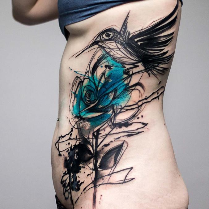 Watercolor rose and bird tattoo