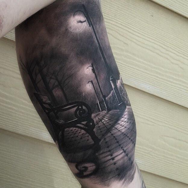 Park bench scene added to a sleeve tattoo