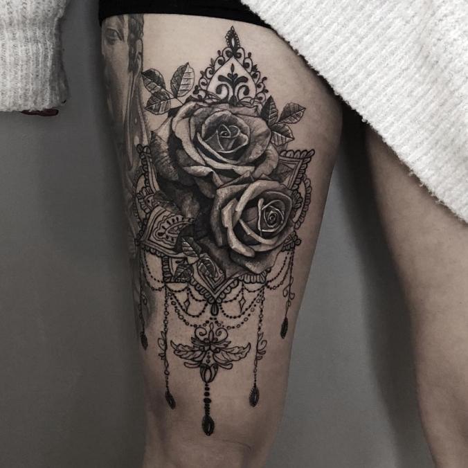 Flower thigh tattoo