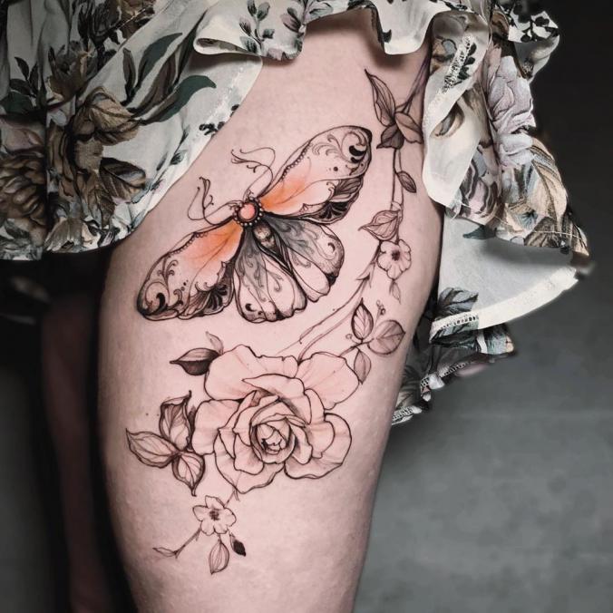 Butterfly thigh tattoo
