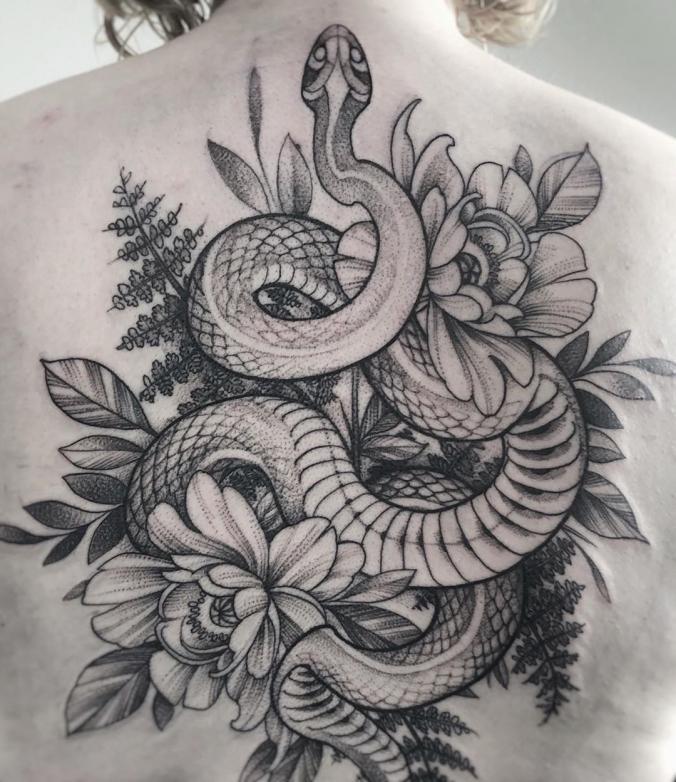 Snake tattoo on the lower back.
