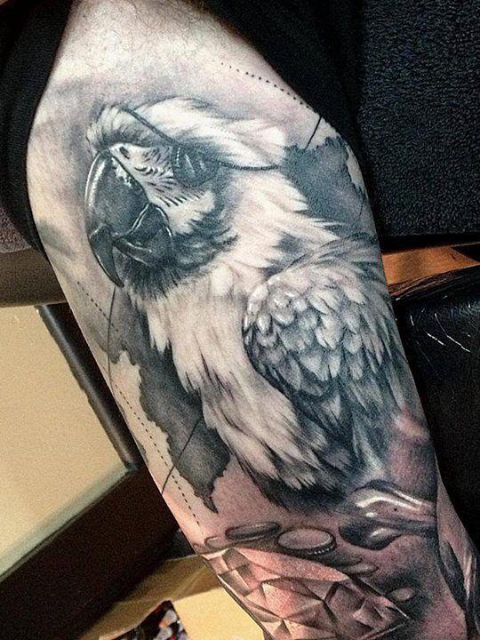 Red Ink Parrot Tattoo On Sleeve