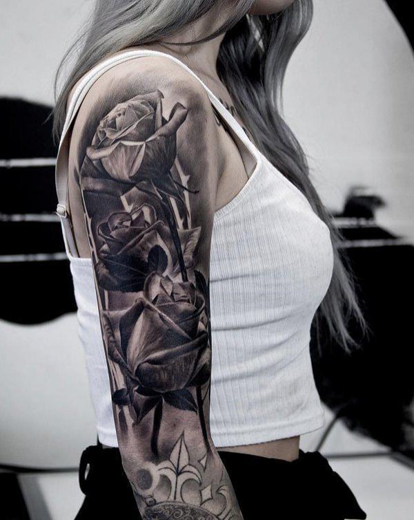 Three roses on arm in black and white