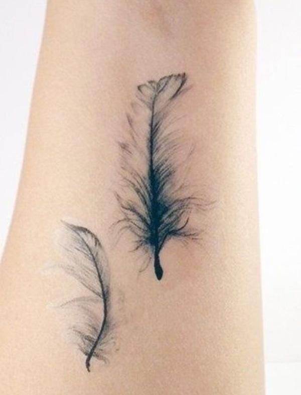 Two plush feathers tattoo