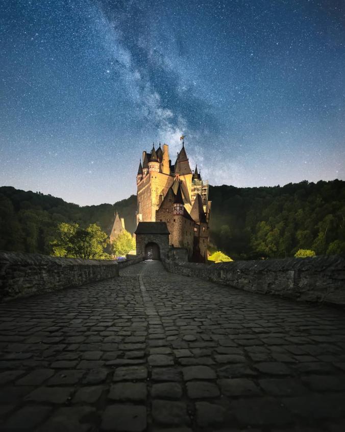 Felix Inden on Instagram ：“A surreal night at the infamous Insta castle Burg Eltz. Not a composite, but in order to show you a both castle and milky way a blending of…”