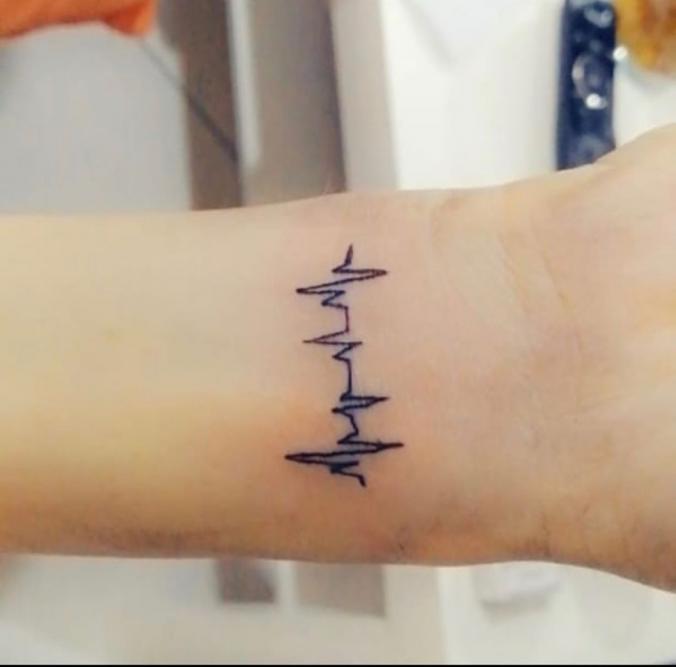 heart beat tattoo on wrist