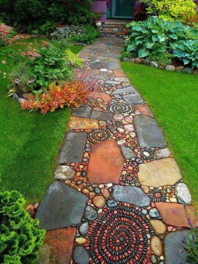 Earthy, terracotta slabs merge with intricate pebble spirals Mosaic Tiles creating gorgeous garden mosaic artwork pathway